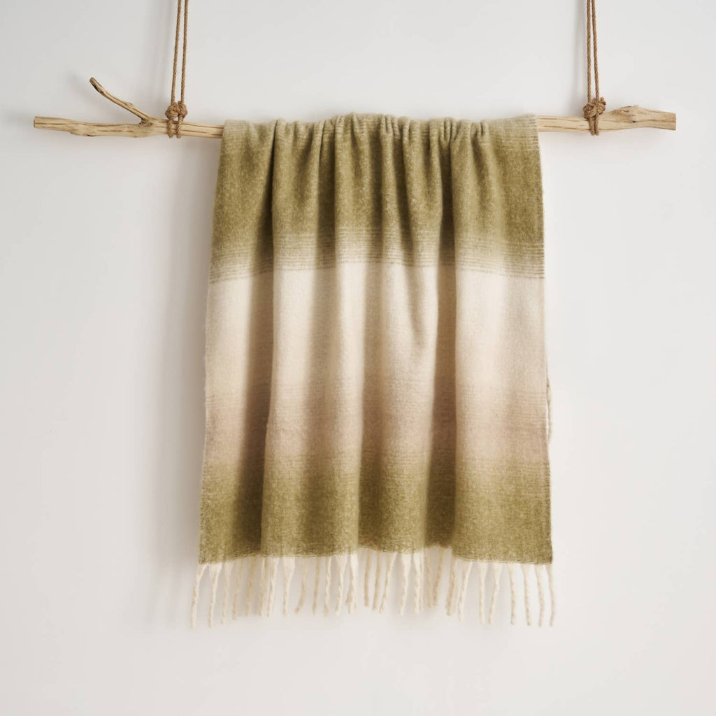 Corner detail of the Highland Mist Ombre Throw showing the tasselled fringe, Croft & Cleo