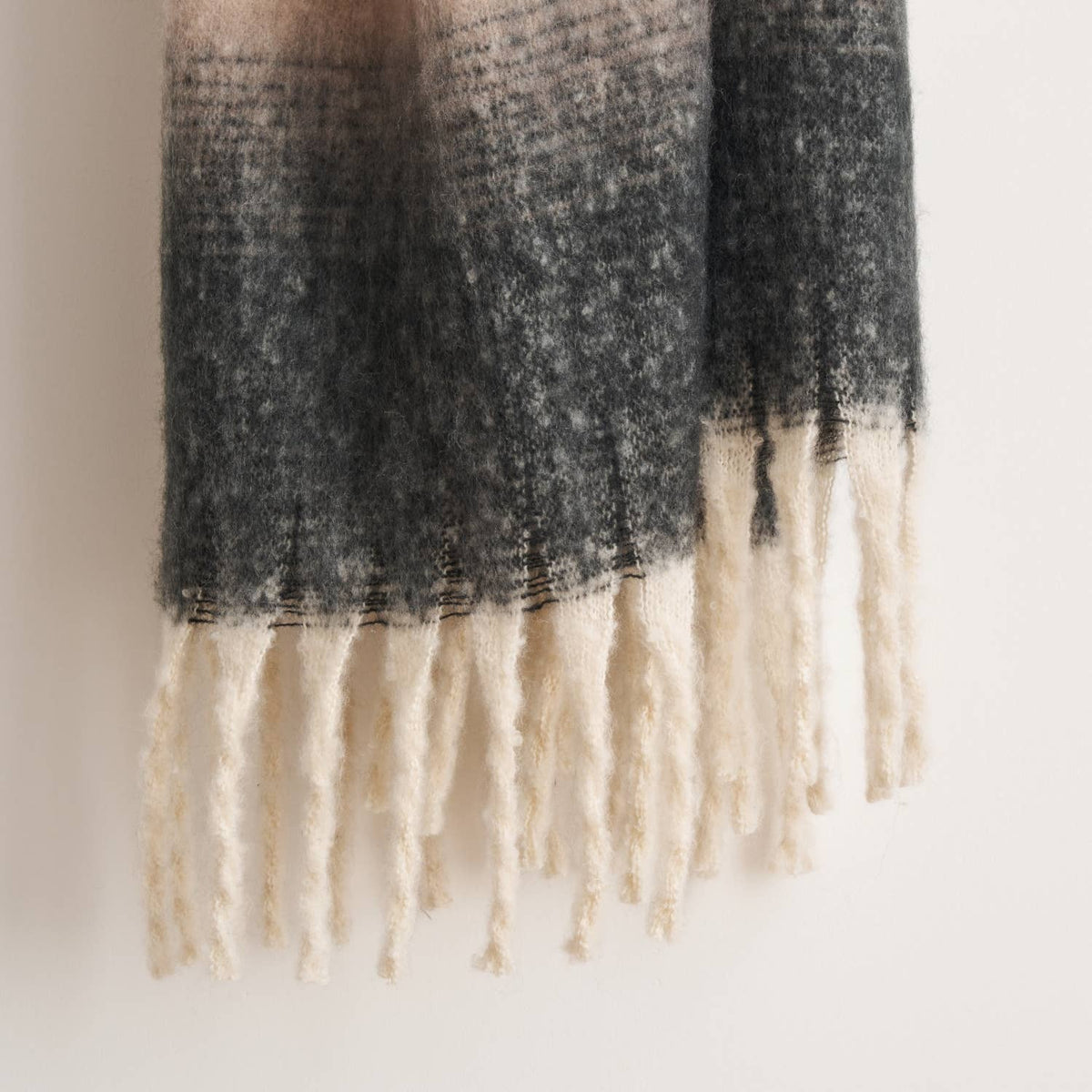 Highland Mist Ombre Throw in Charcoal draped over a chair, Croft & Cleo