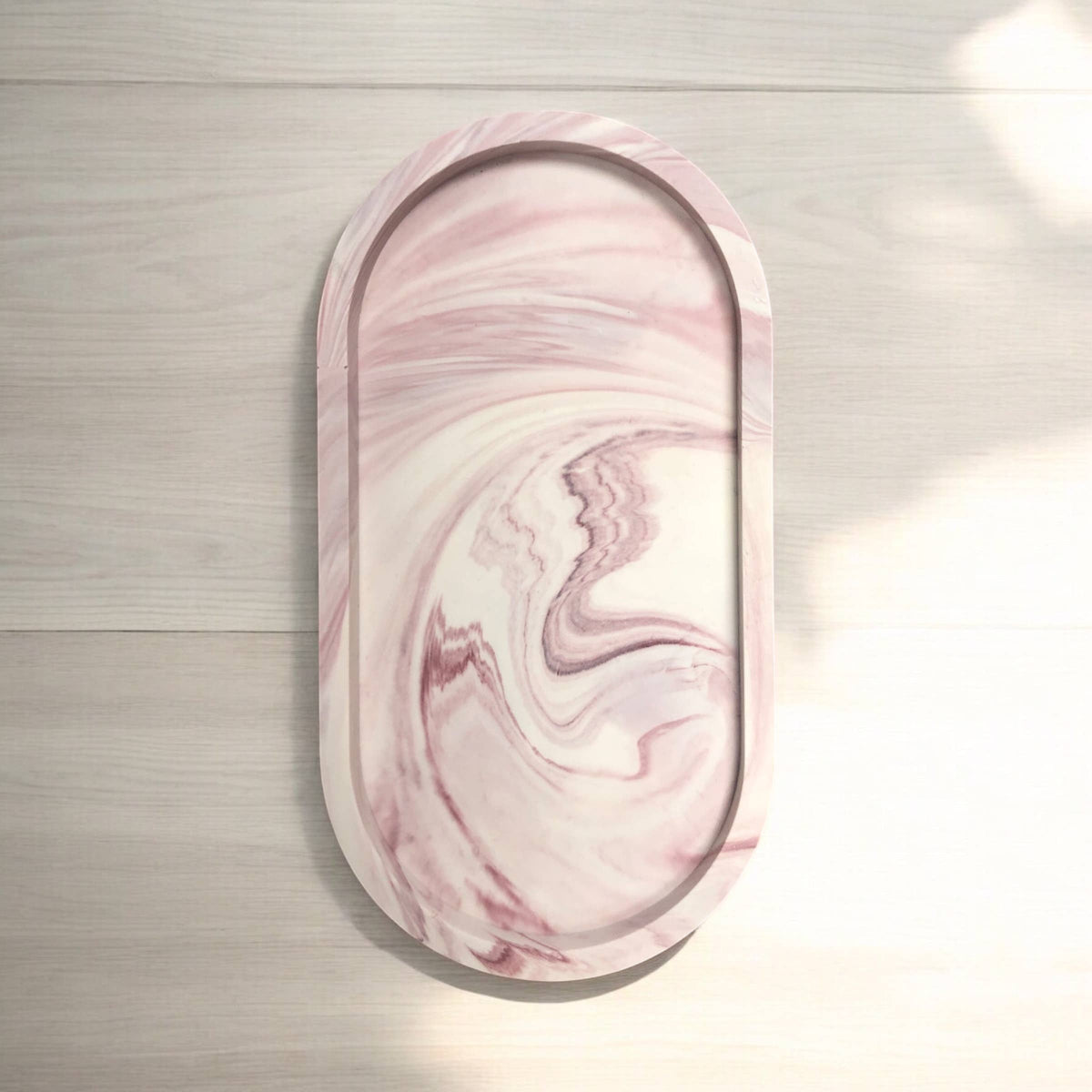 Close-up of deep merlot marble effect on handcrafted Jesmonite oval tray, Croft & Cleo