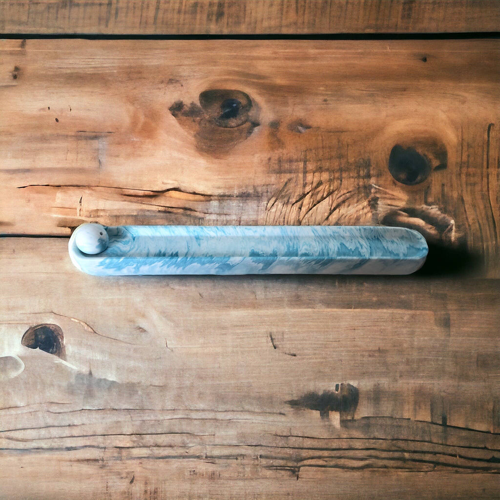Blue marble Jesmonite incense holder viewed from above, showing the full marbled length against reclaimed wood, Croft & Cleo