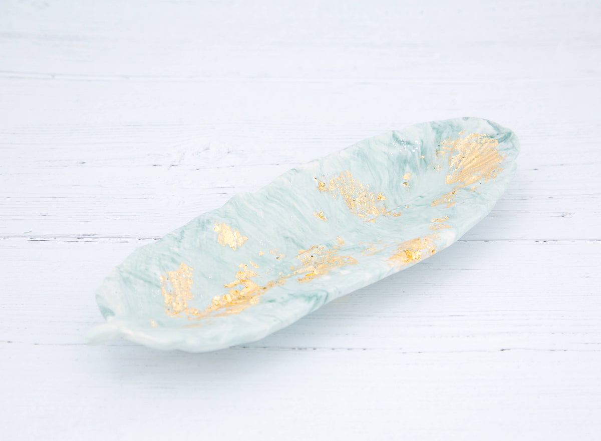 Handmade Jesmonite feather in zen green marble with gold leaf flecks — product shot, Croft & Cleo
