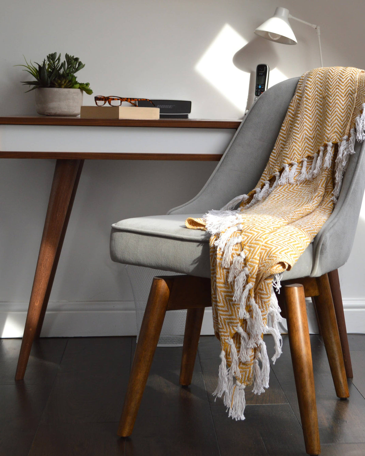 Texture detail of the herringbone weave on the Moorland Herringbone Cotton Throw in Moss, Croft & Cleo