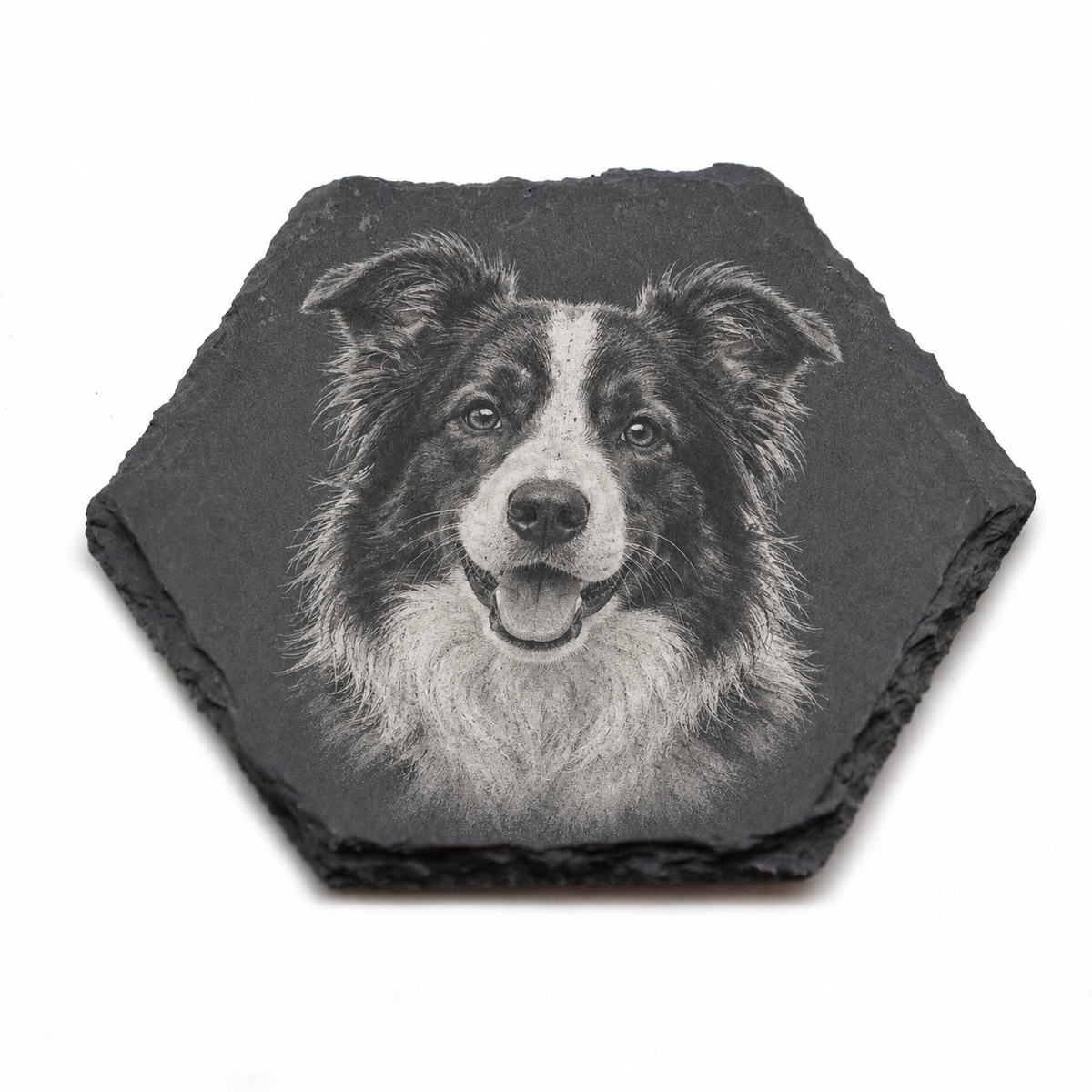 A hexagonal dark slate coaster featuring a detailed black and white sketch of a dog's face, shown on a plain white background.