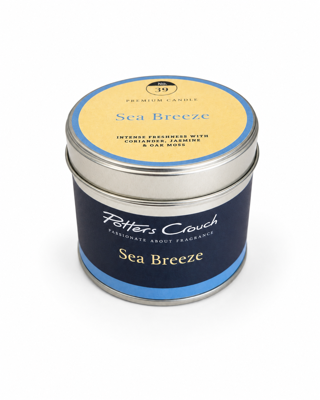 Sea Breeze candle — lit, casting a warm glow, Croft & Cleo