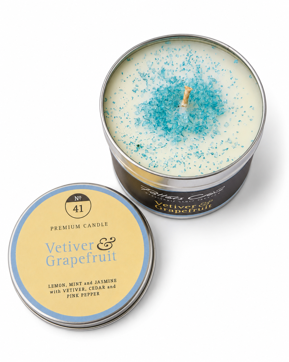 Vetiver & Grapefruit candle — lit, casting a warm glow, Croft & Cleo