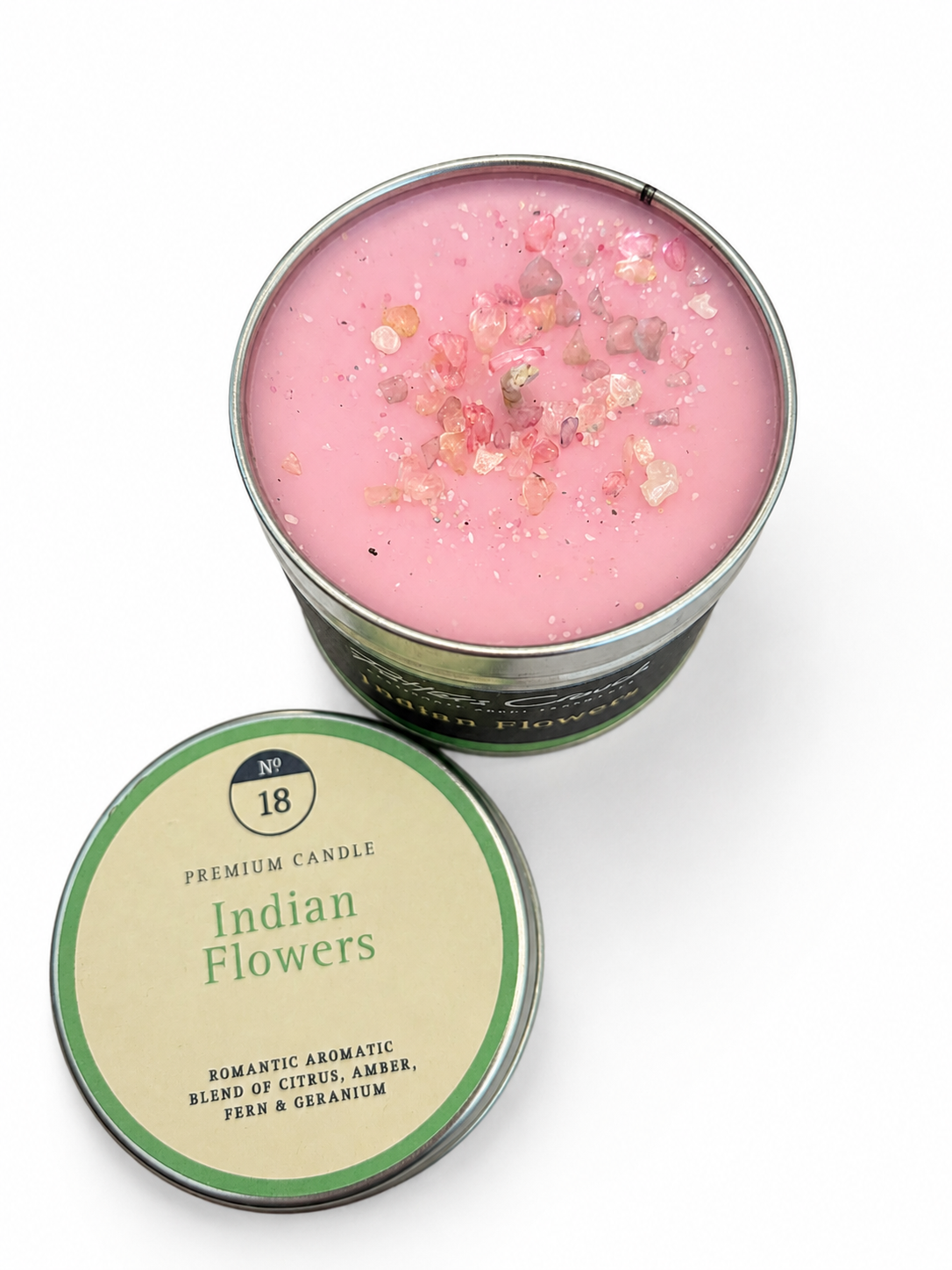 Indian Flowers candle — lit, casting a warm glow, Croft & Cleo