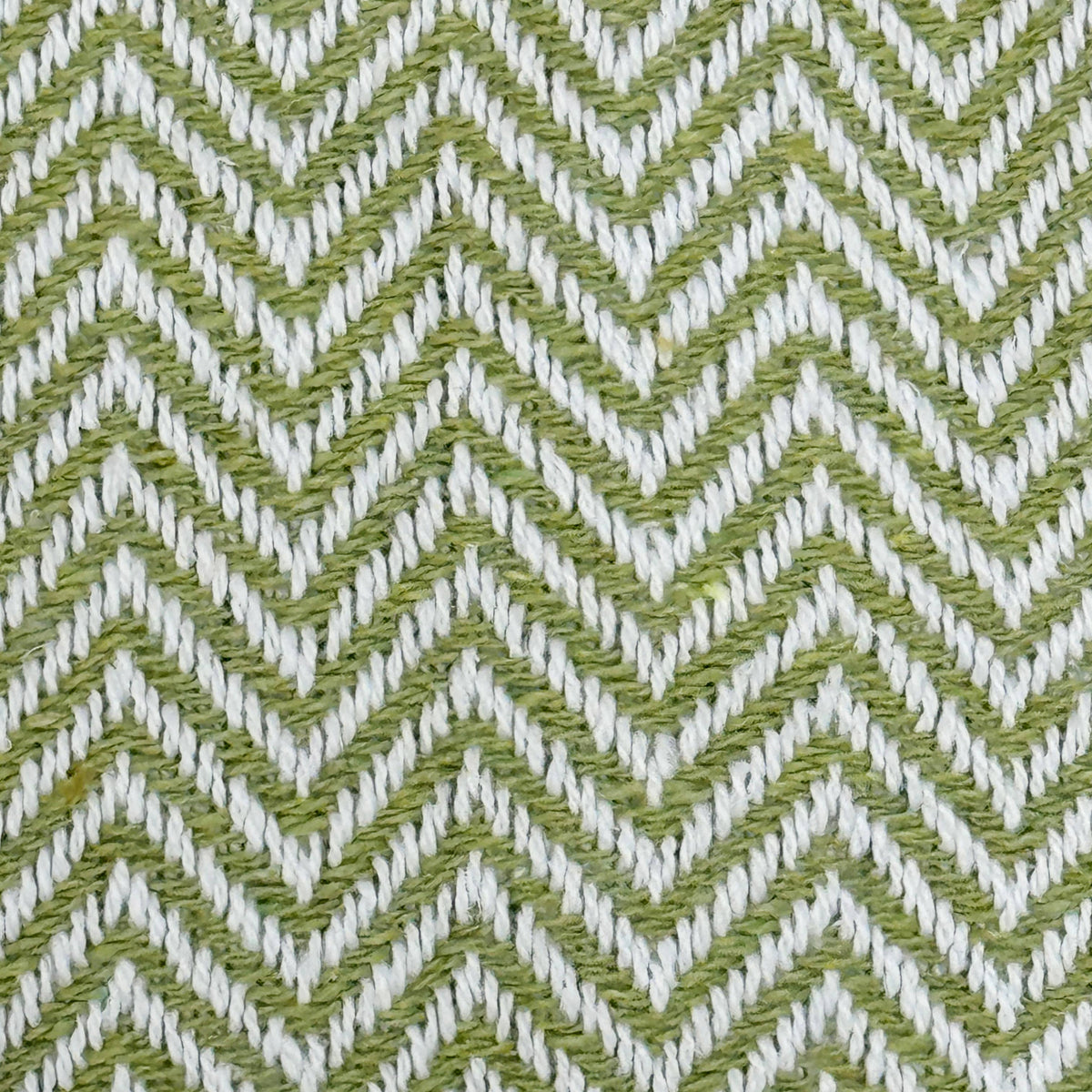 Texture detail of the herringbone weave on the Moorland Herringbone Cotton Throw in Moss, Croft & Cleo