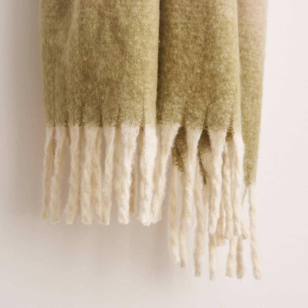 Highland Mist Ombre Throw in Charcoal laid across a bed, Croft & Cleo